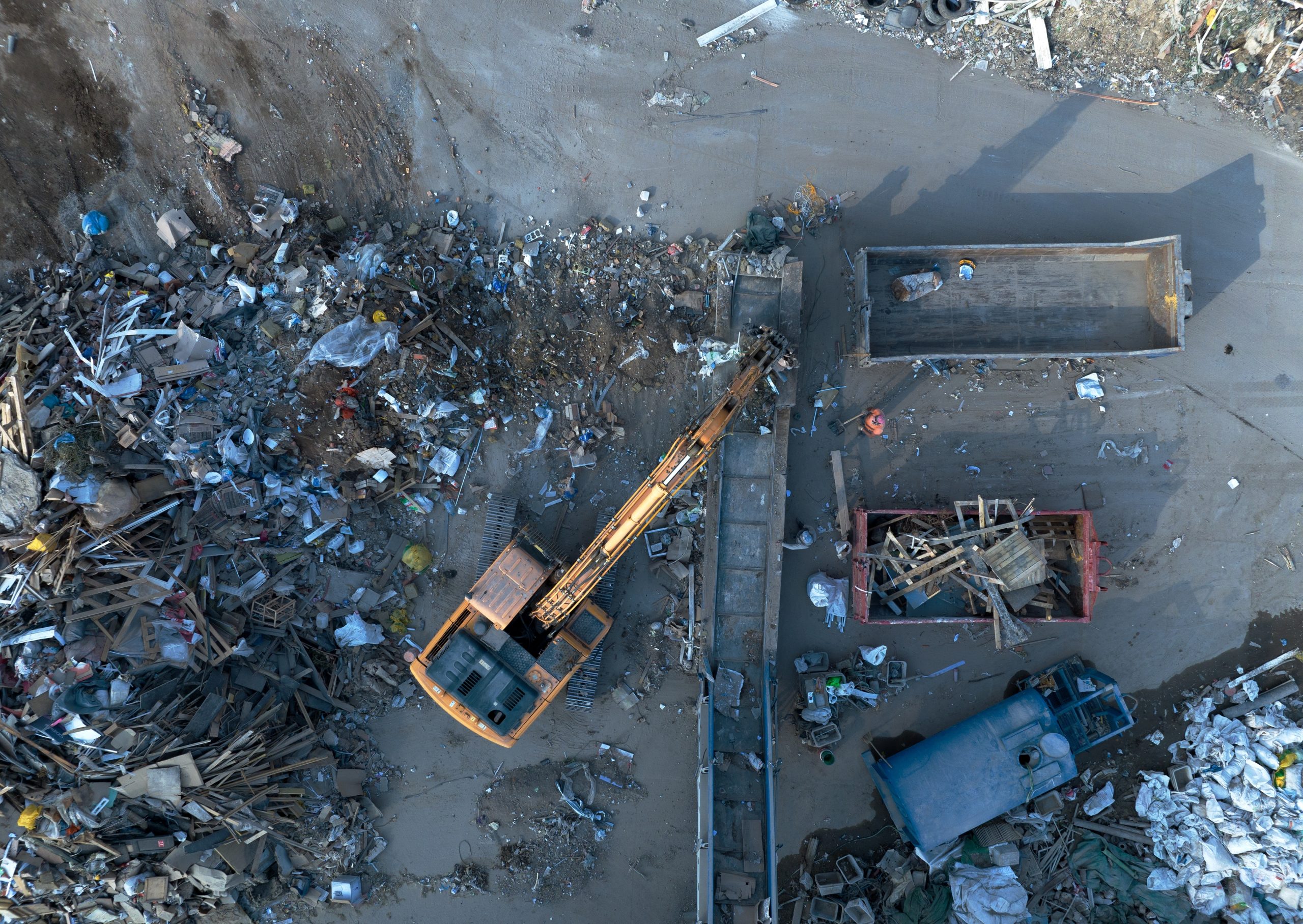 Landfill with construction waste showcasing trash disposal for recycling and cleanup services.