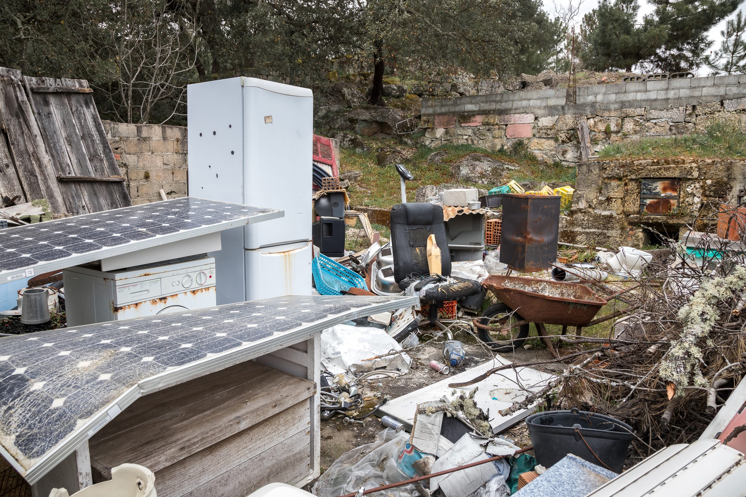 Space full of junk and unused things, illustrating the need for professional property cleanout and junk removal services.